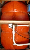 A hot water tank insulated by a detachable jacket.